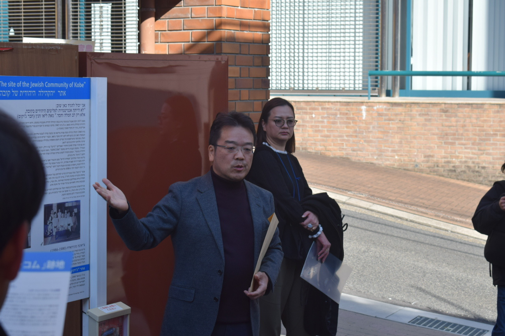 神戸ジューコム跡地について説明している福岡賢二氏